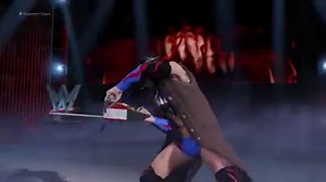 Finn Bálor slinks to the squared circle, chainsaw and all. | IGN