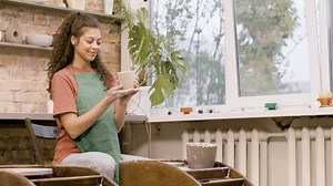 Clerk Woman Modeling Ceramic Piece On A Potter Wheel In A Workshop 3 | Free Stock Video Footage