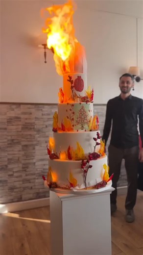 This Fire Cake is Next Level! 🔥 Nelly’s Cakes crafts edible works of art—custom designs, rich flavors, and handcrafted details to make your cake as unforgettable as your love story . . . #epiccake #fireeffect #fyp #nellyscakes #dubai #weddingcake #cake #fire | Arabia Weddings