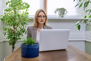 Middle Aged Business Woman Working at Home Using Laptop, Stock Photo - Image of entrepreneur, teaching: 212385380