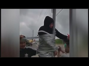 Man duct-taped to pole behind other pranks