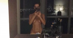 Kim Kardashian Wears Nothing at All While Snapping Her Midnight Spray Tan Session