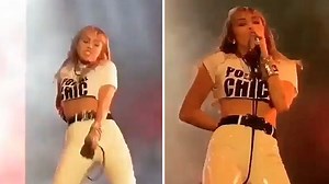 Miley Cyrus flashes her abs in a tiny white crop top