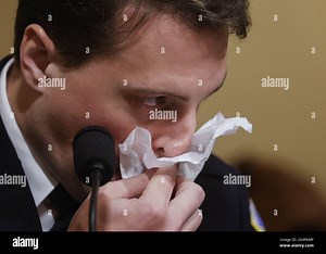 Washington, United States. 27th July, 2021. Metropolitan Police Department Officer Daniel Hodges reacts to watching video footage from his police body camera showing how he was violently attacked at the January 6 attack on the U.S. Capitol at the Canon House Office Building in Washington, DC on Tuesday, on July 27, 2021. About 140 police officers were injured when they were trampled by the former President Donald Trump supporters aiming to overthrow the 2020 presidential election. Five people di