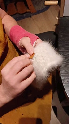 The little things matter 😊 Gunni sawing our logo in one of the earwarmers we make from the hairs of our huskies 😊 | goHusky