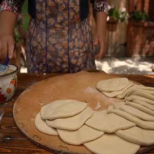 Traditional Lavash Bread Baking Bread on a Barrel Over Wood Fire. | Cosima Villager Foods | Facebook