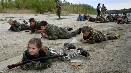 Russian kids crawl with AK-47s & throw grenades as Putin preps next gen army