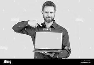 office manager ready for video conference. mature man pointing finger on screen Stock Photo - Alamy