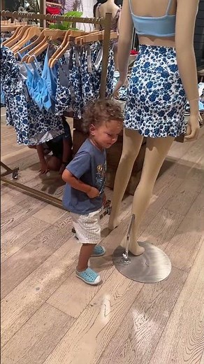 Child plays with mannequin in West Sacramento store
