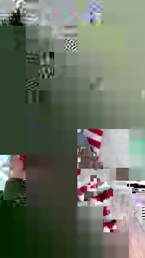 Dollar Tree candy cane wreath with socks! What do you think of this idea??? #christmasdecorations #christmascrafts #dollartreecrafts #dollartreediy | Average But Inspired