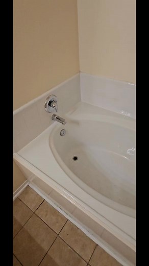 Update on a pay from pay week. We have this home a small makeover by refinishing the tubs, shower pan and kitchen countertops. We also installed a frameless Glass door and installed laminate floors in the kitchen. #remodel #bathtubrefinishing #contractor #katy #HomeImprovement #homedecor | Affordable Tub Refinishing
