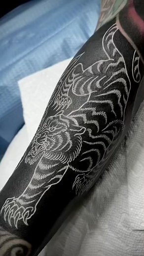Blackout Tattoo with White Ink: Unique and Bold Designs