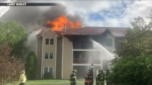 Flames tear through Tewksbury apartment building