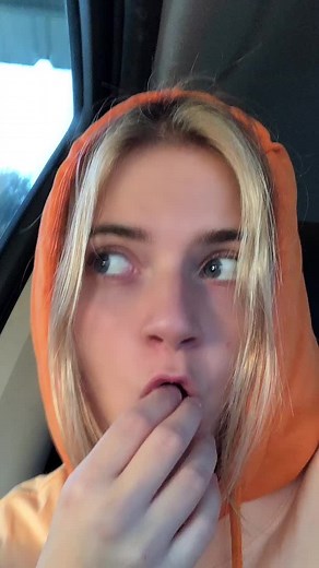 Captivating Moments with a Blonde in an Orange Hoodie