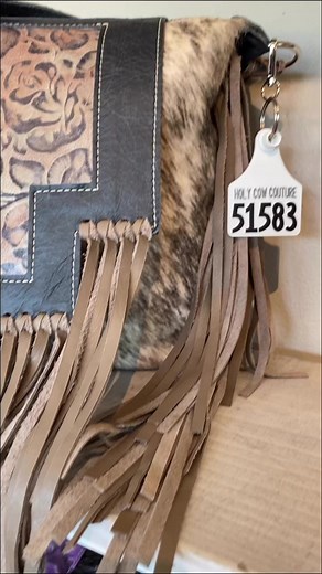2.3K views · 21 reactions | This new embossed is distressed and rustic. Loving it in this Designer. #holycow #cowhide #leatherpurse #crossbody #westernstyle #bagpack #embossedleather #fringe #axishide #ropepurse #bougie #boho #westernpurse #leatherart #smallbusiness #handmade #madeinusa #holycowcouture #couture #fashionstatement #uniquepurse #madeinusa #jointheherd #leatherart #westernfashion #leathergoods | Holy Cow Couture | Facebook