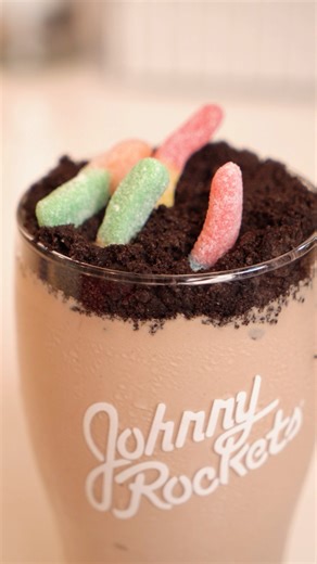 Indulge your tastebuds with our all-new Dirt Cup Shake!✨ Made with our signature Chocolate Shake, chocolate cookie crumbles, and topped with Trolli Sour Brite Crawlers, this combo is the perfect mix of sweet and sour gummi wormie goodness. Only available for a limited time, so get yours today! The Dirt Cup Shake is available at participating locations for a limited time only. Menu offering sand pricing vary by location. TROLLI®️is a registered trademark of Ferrara Candy Company, used with permis