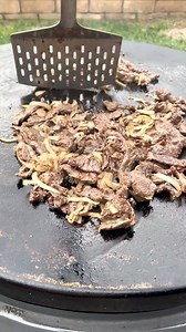 Cheesesteak sandwiches on the round griddle | Miguels cookingwithfire