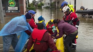 Family being rescued on Waverly Avenue in Mamaroneck