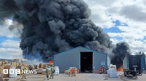 Twenty firefighters remain at West Bromwich cardboard blaze