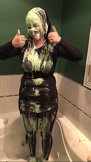 Cute girl in tights takes 2 buckets of gunge and a pie in her face
