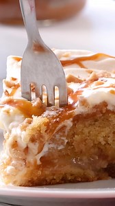 Well hello caramel lovers! 😍 If you're looking for decadent caramel dessert, this Caramel Apple Toffee Cake is it. We start with a homemade spiced sheet cake smothered with layer of sweet apples and toffee bits. Just after it comes out of the oven, it becomes a poke cake and we drizzle caramel sauce all over it. But wait, we're still not done... next we top it fluffy whipped cream, even more caramel and more toffee! Get the recipe from The Novice Chef https://www.dixiecrystals.com/recipes/caram