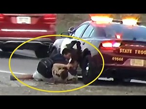 State Trooper wrestles highway pedestrian to the ground