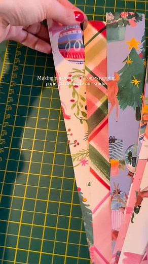 Making paper chains from our Bluebellgray wrapping paper to decorate the studio ✨ So easy, so joyful, and such a sweet little trip down memory lane with all our Christmas designs past and present. These ones are about 3.5cm wide but it’s fun experimenting with different strip sizes and lengths ✂️ If you’ve got a little extra time, glue would give a neat finish but the stapler is fast! Next time might definitely trying to make them double-sided or with a coloured reverse🎄💙 | Bluebellgray