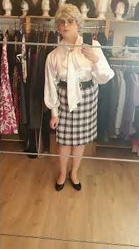 elegant crossdresser as mature lady in satin bow blouse and pleated skirt