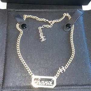 CHANEL excellent condition preloved metal  crystal pearl logo necklace gold.