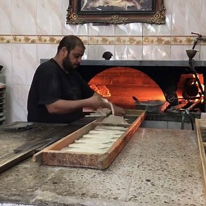 How about a glimpse of #Iraq that doesn't involve war or suffering? This was breakfast on the way to one of our medical clinics: samoon, a traditional Iraqi flat bread. It is so, so good. And this guy has his craft down to an art form. There is beauty everywhere you look in this place. | Search for Common Ground
