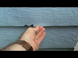 HandyANDY repairs rotted LP siding and delaminating Nichi siding for Woodstock homeowner