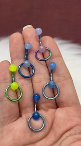 549K views · 2.4K reactions | Who needs a flashlight when your belly ring glows in the dark?  Meet the Door Knocker Belly Ring, made with sleek anodized titanium and a glow-in-the-dark charm that’s basically the life of the party (and your outfit). Shine bright, day or night! ✨ #GlowModeOn #BellyRingGlowUp #PiercingPartyVibes | BodyJewelry.com | Facebook
