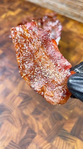 Maple Sriracha Candied Bacon by @cookingintheyard This is a MUST try. Sweet, Savory, Bacon-y! RECIPE: 1lb Bacon 1C Maple Syrup 1/2C Soy Sauce 1 TBSP Sriracha Ground Black Pepper 🥓 Slice bacon in half and trim off the fatty end that won’t render 🥓 Lay each slice on a wire rack and add a heavy pinch of brown sugar to each - spread out evenly 🥓 Bake at 350F for 20-25 minutes until bacon is a dark amber color and brown sugar is bubbly 🥓 Remove from oven and let cool for 5-10 minutes, this will a