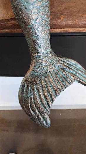 Who doesn’t love a mermaid? This beautiful cast iron mermaid shelf sitter adds a bit of whimsy to your home decor and would make a lovely addition to any bookshelf #MermaidMagic #UnderTheSeaDecor #OceanInspiredHome #MermaidVibes #SeaSirenStyle #EnchantingInteriors #MagicalHomeDecor #AquaAccents #MermaidChic #CoastalLivingDecor #dodwelldesigns | Dodwell Dwellings