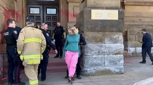 Watch: Topless climate activist dumps paint all over the Canadian Prime Minister's Office exterior and chains herself to railing. She is the same topless woman that jumped on stage at the Junos. The fire department cut the chain and she was arrested by police.. | The Canadian Independent