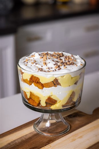 The Kneaders family knows and loves this recipe! We can’t gatekeep it anymore, save this video to make our easy, deliciously-fall Pumpkin Trifle ❤️‍🔥 Ingredients: - 2 loaves Kneaders Pumpkin Bread, cut into 1-inch cubes - 1 (4.6-ounce) package vanilla pudding mix, such as Jell-O Cook and Serve - 2 cups milk - 1/2 cup brown sugar, packed - 1/3 teaspoon ground cinnamon - 1 (16-ounce) tub frozen whipped topping, such as Cool Whip, thawed - 1/2 cup chocolate toffee bits or 5 (1.4-ounce) toffee cand