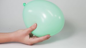 Sequential handling of a balloon over time | Premium Stock Video Footage