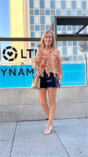 Michelle Averitt | Petite Style on Instagram: "About last night! New friends, old friends, mocktails, the piano, the food & of course the outfits! Day 1 of #LTKCon was full & fun, informative & challenging, and I’m trying to soak up every bit of it to take home and apply to my business. My look is a shear ruffle top (runs small). I’m wearing a PXXS. Faux leather shorts , run tts. I’m wearing an XS Nude Heels (no longer an but I’ll link another option) Nude purse Comment SHOP below to receive a D