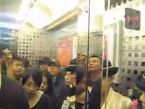 Crowded elevator at Sogo Center Mall in Taipei, Taiwan