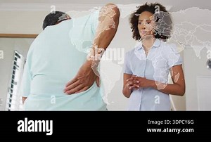 Senior man holding lower back in pain, therapist asking questions with translucent map overlay. Health, wellness, recovery, empathy, rehabilitation, digital, consultation Stock Video Footage - Alamy
