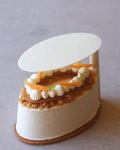The peach crumble! Inspired by my favoruite childhood dessert, I used a 3D printer to create a custom oval mold, filling it with an almond streusel, peach cream, peach compote and vanilla masccarpone whip. I thought my custard might melt through the chocolate decoration but it was a fail 😅 | Matt Adlard