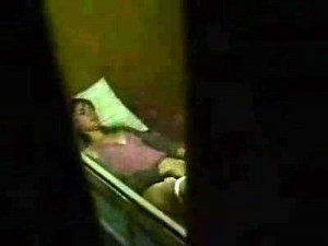 Cute brunette caught masturbating by a window peeper