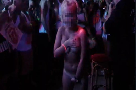 Naked girl performs humiliating forfeit