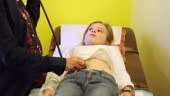 MS Shot of young girl getting physical exam at doctor's office /...