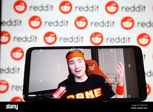 Keith Gill, known on Reddit under the pseudonym DeepFuckingValue and as Roaring Kitty, is seen on a fragment of a youtube video displayed on a smartphone screen in front of Reddit logo Stock Photo - Alamy