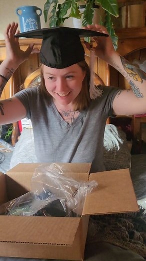 My graduation regalia arrived yesterday- cap, gown, and first-generation sash. In two weeks, I’ll roll across the stage and close a chapter I fought hard to write. This means more than words can capture. Thank you to everyone who has supported me, believed in me, and stood by me through it all. I didn’t do this alone. Thanks for filming a special moment Beth Roach 🫶🏻 Celebrating this moment with deep gratitude—#FirstGenGraduate #Graduation2025 #HardEarned #AgainstTheOdds #Resilience #CapAndGow