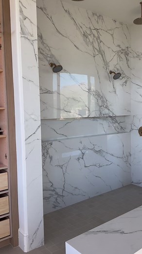 The full slab shower with the custom vanity wall at our #TranquilDesertRetreat project. PHX Architecture Laura Kehoe Design | AFT Construction | Facebook