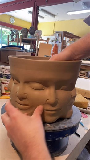 Love in Pottery on Instagram: "Adrien Miller (@adrienmillerart) is a ceramic artist based in Seattle, known for blending figurative sculpture with functional pottery. His signature work merges human forms with vessels, allowing clay to become both expressive art and everyday ceramics. Adrien showcases his mesmerizing process, forming faces directly from clay to create a sculptural planter. He leaves the inside unglazed so plant roots can grip the surface and cleverly uses two pens to block the d