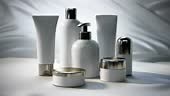 Seven bottles of various sizes, shapes, and materials, each with a...