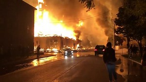 A building was engulfed in flames early Thursday morning, May 28 as riots erupted in Minneapolis, Minnesota, following the death of George Floyd. http://via.fox6now.com/iEhyf Credit: Max Nesterak/Minnesota Reformer via Storyful | FOX6 News Milwaukee